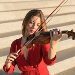 front-view-violinist-playing-steps_23-2148485119